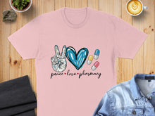 Load image into Gallery viewer, Pink t-shirt with "peace love pharmacy" text and pill graphics.
