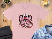 Load image into Gallery viewer, Pink t-shirt with a nurse's cap, stethoscope, and "XOXO" bow design.
