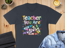 Load image into Gallery viewer, Dark t-shirt with "Teacher You Are" and crayon designs with Bible verses.
