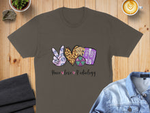 Load image into Gallery viewer, Brown t-shirt with peace, heart, and radiology graphic and text.
