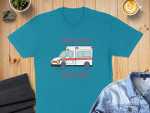 Load image into Gallery viewer, Teal t-shirt with graphic of a white and red ambulance and text "WEE MOO DRIVER".
