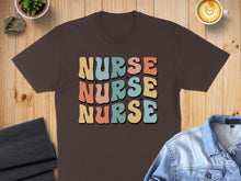 Load image into Gallery viewer, Brown t-shirt with "NURSE NURSE NURSE" in colorful retro lettering.
