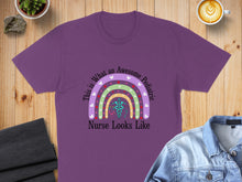 Load image into Gallery viewer, Purple t-shirt with a rainbow and stethoscope graphic, text "This is What An Awesome Pediatric Nurse Looks Like".

