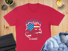 Load image into Gallery viewer, Red t-shirt with shield logo for Independence Day, USA.
