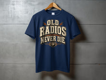 Load image into Gallery viewer, Navy t-shirt with the text "OLD RADIOS NEVER DIE" in distressed lettering.
