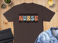 Load image into Gallery viewer, Brown t-shirt with "Nurse Love Inspire Heal" text and checkered pattern.
