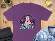 Load image into Gallery viewer, Purple t-shirt with a ghost and "You Can't Scare Me I'm a Nurse" text.
