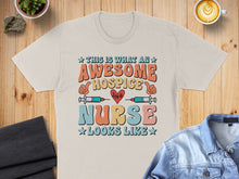 Load image into Gallery viewer, "This is what an awesome hospice nurse looks like" text on a cream t-shirt.
