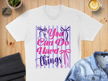 Load image into Gallery viewer, White t-shirt with "You Can Do Hard Things" text and bow graphics.
