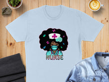 Load image into Gallery viewer, Light blue t-shirt with cartoon nurse illustration featuring a mask and butterflies.
