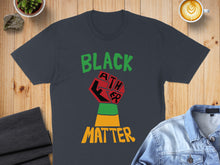 Load image into Gallery viewer, Black Panther fist graphic on a dark t-shirt.
