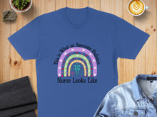 Load image into Gallery viewer, Blue t-shirt with a rainbow and stethoscope, "This is What An Awesome Pediatric Nurse Looks Like".
