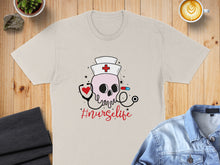 Load image into Gallery viewer, T-shirt with a skull wearing a nurse's hat, stethoscope, and the text "#nurselife".
