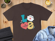Load image into Gallery viewer, Brown t-shirt with "LOVE" graphic featuring stethoscope, heart, and nurse cap.
