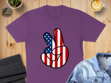 Load image into Gallery viewer, Purple t-shirt with American flag peace sign graphic.
