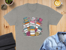 Load image into Gallery viewer, T-shirt graphic with cartoon pill bottles wearing hats and holding signs.
