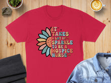 Load image into Gallery viewer, Red t-shirt with "It takes a lot of sparkle to be a hospice nurse" text and floral design.
