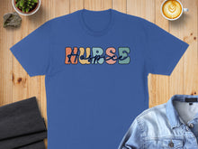 Load image into Gallery viewer, Blue t-shirt with colorful "Hospice" text and surrounding items.
