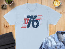 Load image into Gallery viewer, Light blue t-shirt with distressed "1776" USA flag design.
