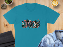 Load image into Gallery viewer, Teal t-shirt with "Nurse" text and stethoscope design.
