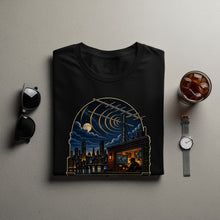 Load image into Gallery viewer, Black t-shirt with a night cityscape, radio tower, and person in an office.
