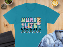 Load image into Gallery viewer, Teal t-shirt with "Nurse Life Is The Best Life" text and colorful flowers.
