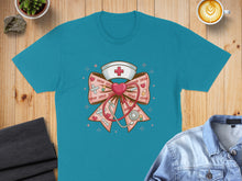 Load image into Gallery viewer, Teal t-shirt with pink bow, stethoscope, and nurse's cap with x's and o's.
