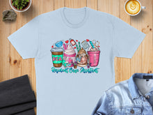 Load image into Gallery viewer, Light blue t-shirt with "RCA Resident Care Assistant" text and coffee cup graphics.
