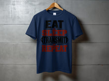 Load image into Gallery viewer, Navy t-shirt with "EAT SLEEP TRANSMIT REPEAT" text graphic.
