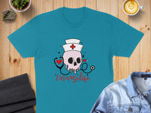 Load image into Gallery viewer, Turquoise t-shirt with skull nurse graphic and "#nursecit" text.
