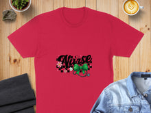 Load image into Gallery viewer, Red t-shirt with "Nurse" text, stethoscope, and floral accents.
