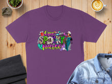 Load image into Gallery viewer, Purple t-shirt with "One Spooky Nurse" graphic featuring Halloween-themed medical icons.
