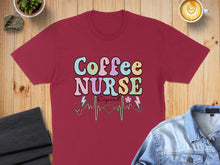 Load image into Gallery viewer, Burgundy t-shirt with "Coffee Nurse Repeat" text and heart monitor design.
