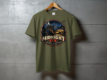 Load image into Gallery viewer, Olive green t-shirt with "MIDNIGHT DX" graphic and "The World Is Still Awake" text.
