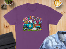 Load image into Gallery viewer, Purple t-shirt with cartoon truck, "Nurse Life" text, and medical supplies.
