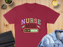 Load image into Gallery viewer, Burgundy t-shirt with "Nurse Mode All Day Every Day" text and band-aids.
