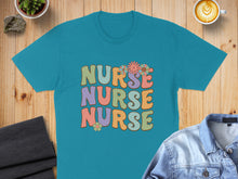 Load image into Gallery viewer, Teal t-shirt with "NURSE NURSE NURSE" in colorful retro font.
