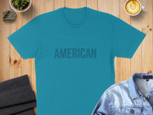 Load image into Gallery viewer, Teal t-shirt with "AMERICAN" text in a repeating pattern.
