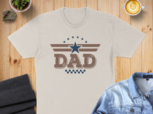 Load image into Gallery viewer, Cream t-shirt with "DAD" text, stars, and checkered pattern design.
