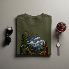 Load image into Gallery viewer, Olive green t-shirt with illustration of person operating radio in nature.
