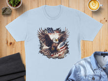 Load image into Gallery viewer, Light blue t-shirt featuring an eagle in flight against an American flag background.
