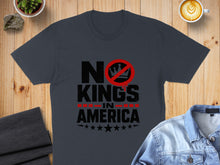 Load image into Gallery viewer, Dark grey t-shirt with "No Kings in America" text and crossed-out crown logo.
