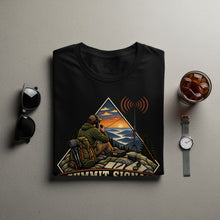 Load image into Gallery viewer, Black t-shirt with "Summit Signal" graphic of a person with a radio in the mountains.
