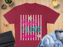 Load image into Gallery viewer, Maroon t-shirt with "Teach Love Inspire" text and colorful floral and ribbon graphics.

