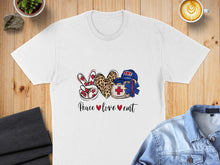 Load image into Gallery viewer, White t-shirt with "Peace❤love❤emt" graphic featuring a leopard print peace sign and medical cross.
