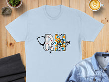 Load image into Gallery viewer, Light blue t-shirt with "RN" in Halloween-themed lettering and a stethoscope.
