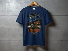 Load image into Gallery viewer, Navy t-shirt with "When the City Sleeps I Transmit" graphic of a city skyline and radio tower.

