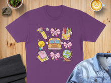 Load image into Gallery viewer, Purple t-shirt with colorful back-to-school icons: bus, crayons, book, globe, lightbulb.
