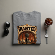 Load image into Gallery viewer, Grey t-shirt with wanted poster design of a microphone in a desert landscape.
