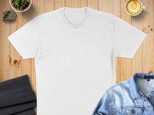 Load image into Gallery viewer, White t-shirt, coffee, plants, and denim jacket arranged on wooden surface.
